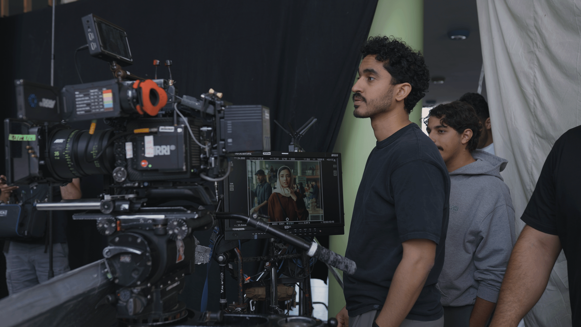 Abdullah Bamajboor looking at a monitor